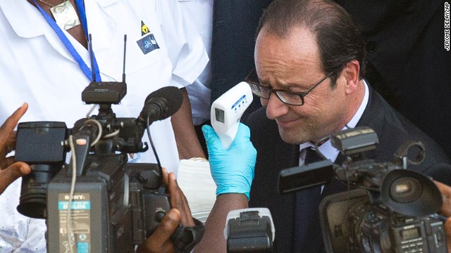 President Hollande of France entering an ebola hospital in West Africa.