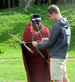 A  Maasai instructs Lucas Massimini.